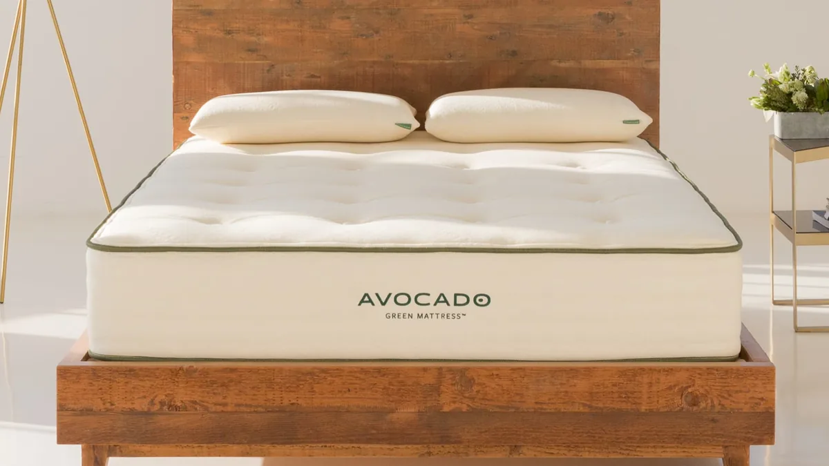 Avocado Green mattress on a reclaimed-wood bed