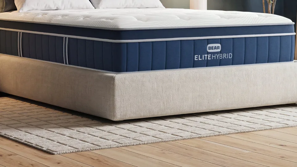 Bear Elite Hybrid mattress on an upholstered bed