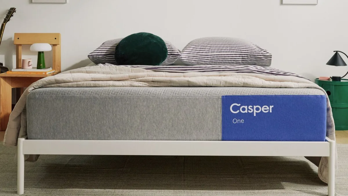 Casper The One mattress on a white bed frame