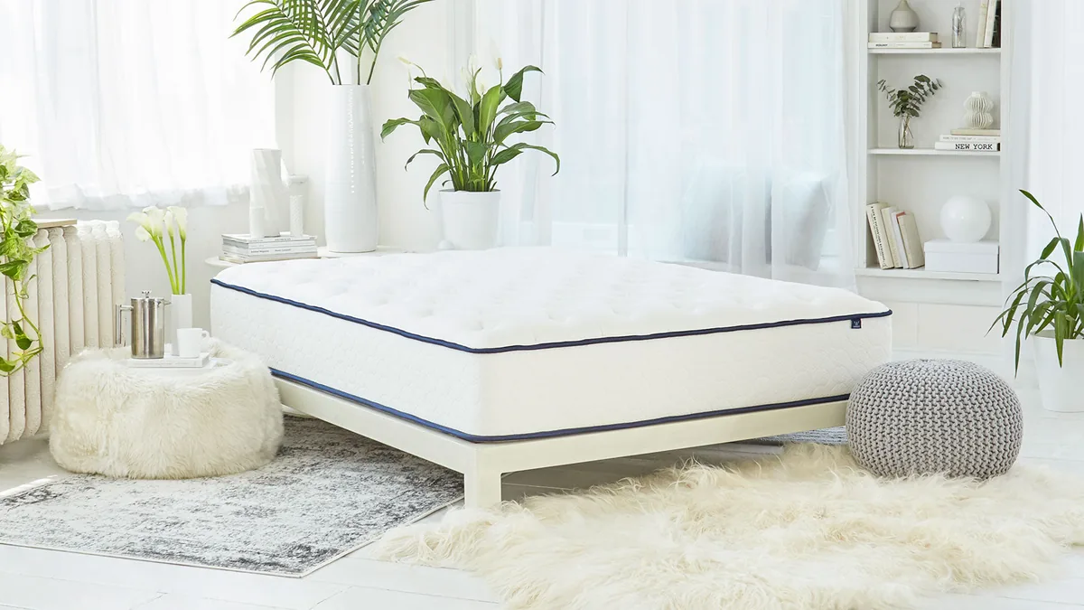 WinkBeds GravityLux mattress on a white bed frame
