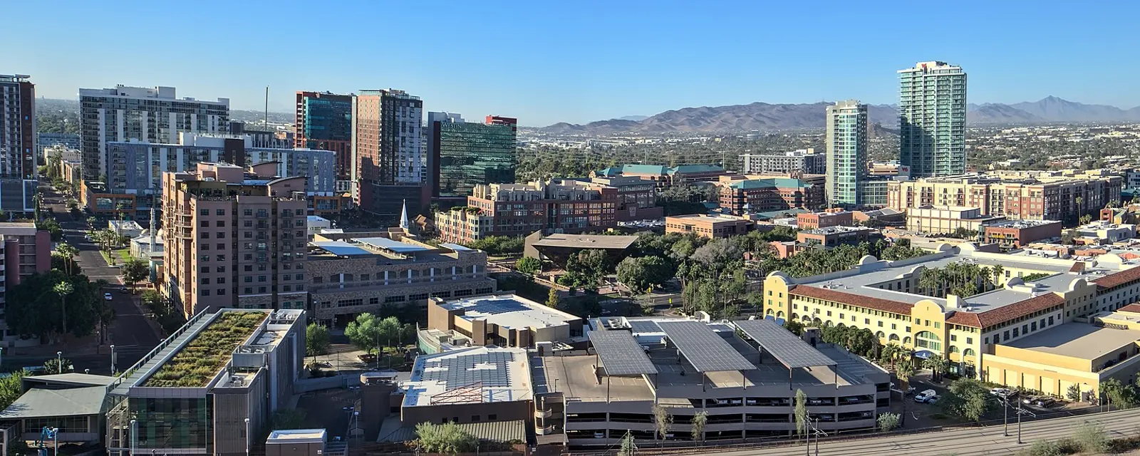 Downtown Tempe from above with the mountains behind it