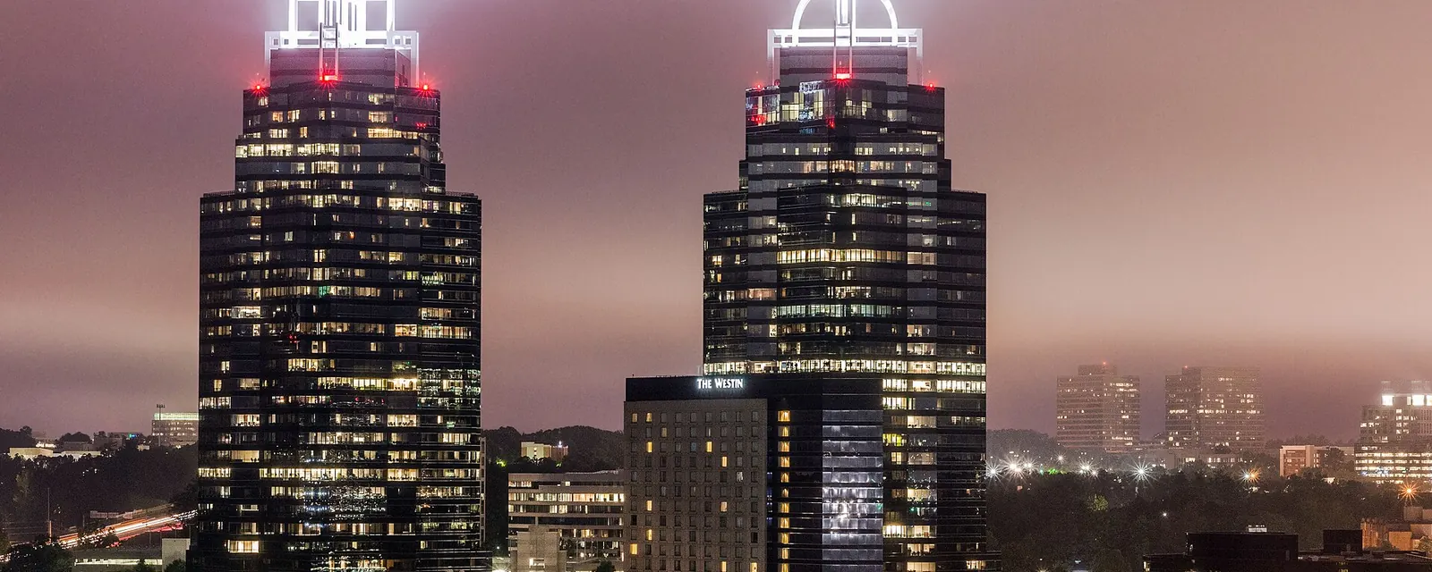 The King and Queen office towers lit up at night in Sandy Springs, Georgia