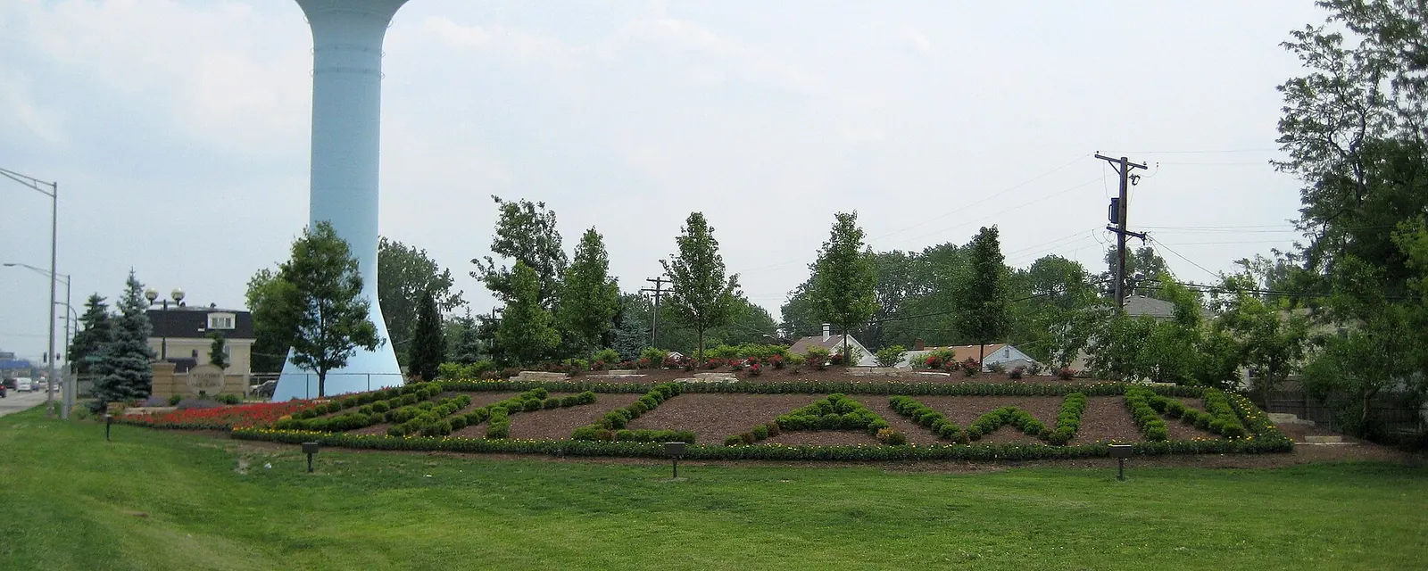 The Oak Lawn water tower above the village name planted in flowers in Oak Lawn, Illinois