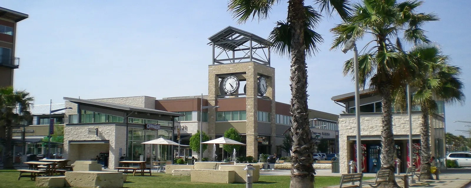 Clock tower and palm trees at Pearland Town Center